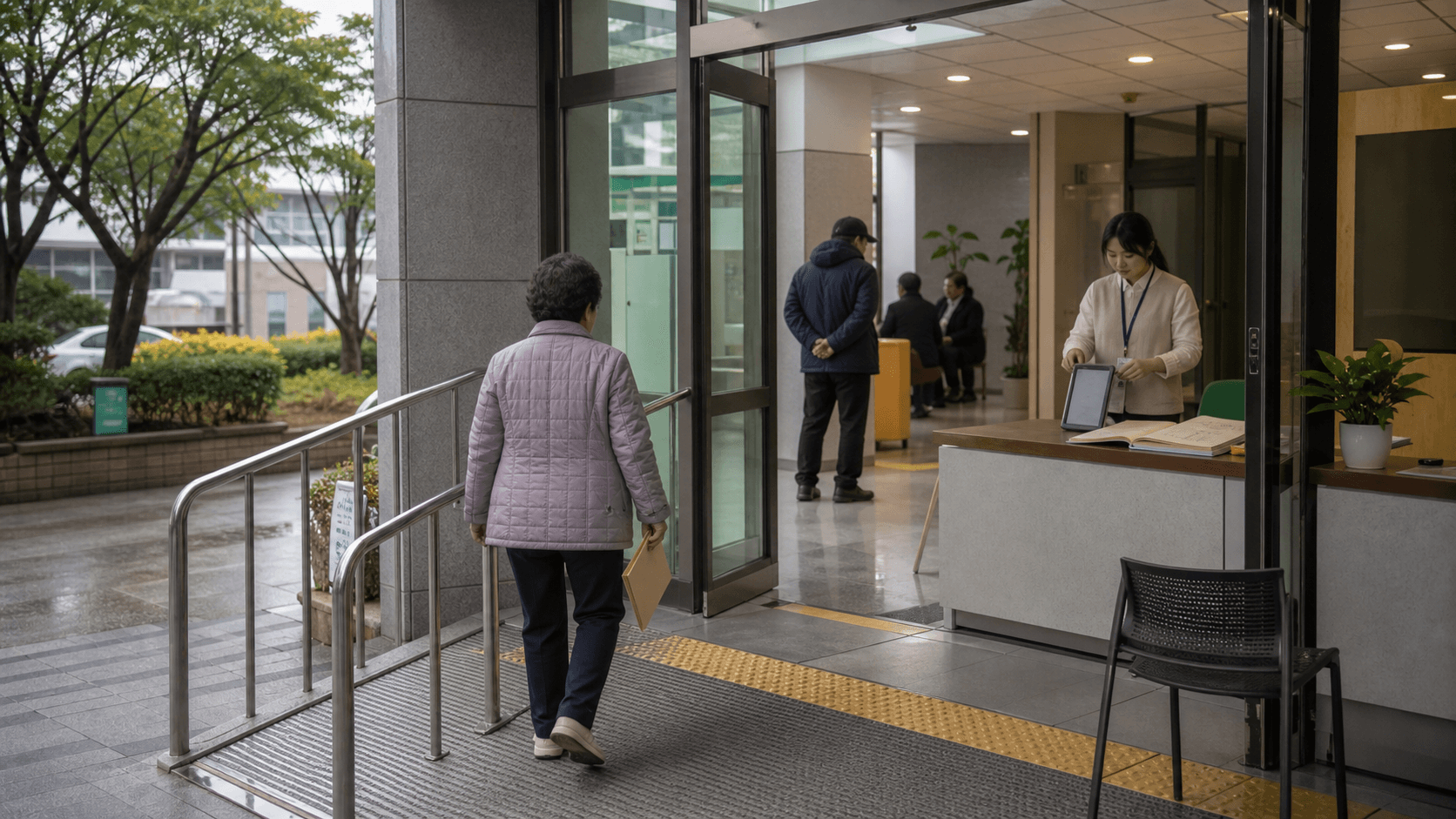 접근 가능한 주민센터 입구에서 신청을 돕는 장면의 편집 이미지